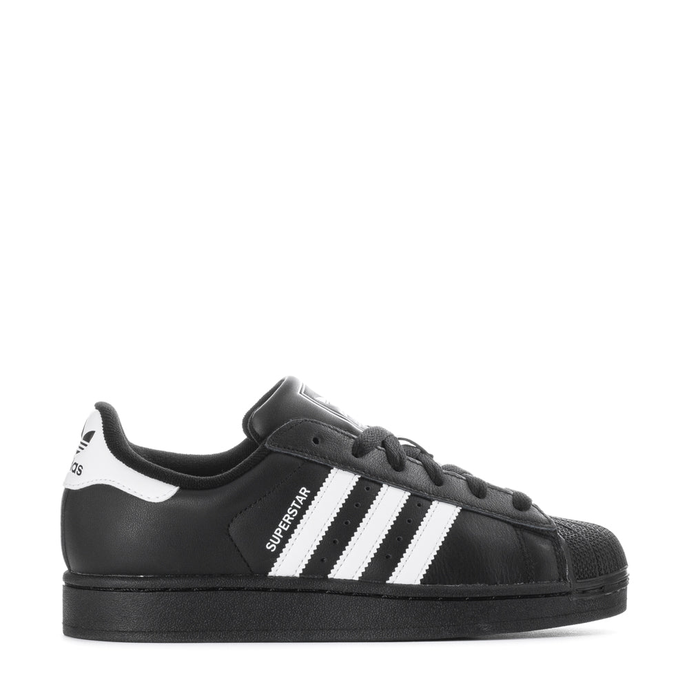 Adidas Superstar Women's Fashion Sneakers in a bold monochrome colorway, highlighting the iconic shell-toe design.