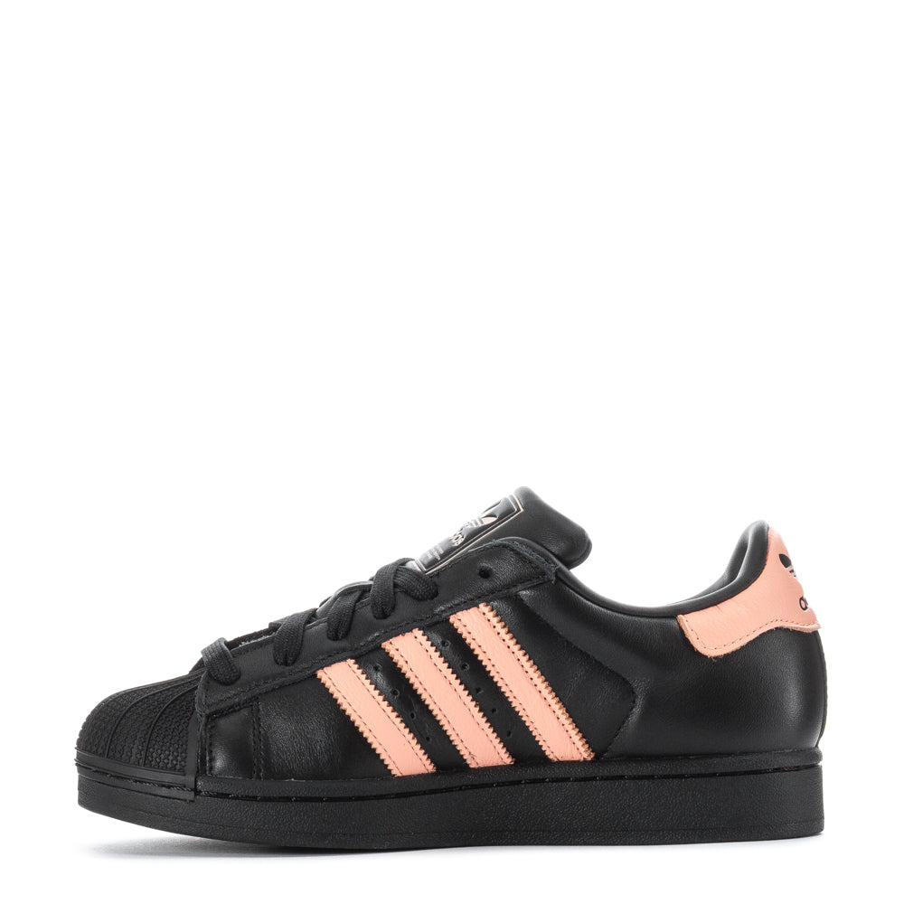 Close-up of the Adidas Superstar shell-toe and padded collar, showcasing comfort and style.