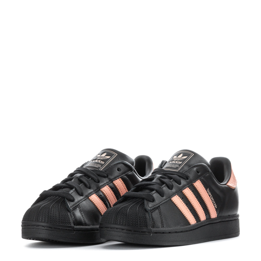 Adidas Superstar womens sneakers in action, displaying grip and comfort during a casual outing.