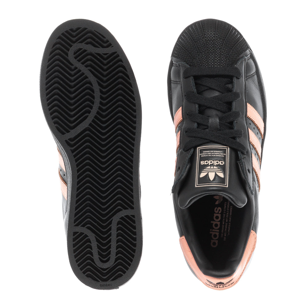 Adidas Superstar womens sneakers from the side, highlighting the sleek leather design.