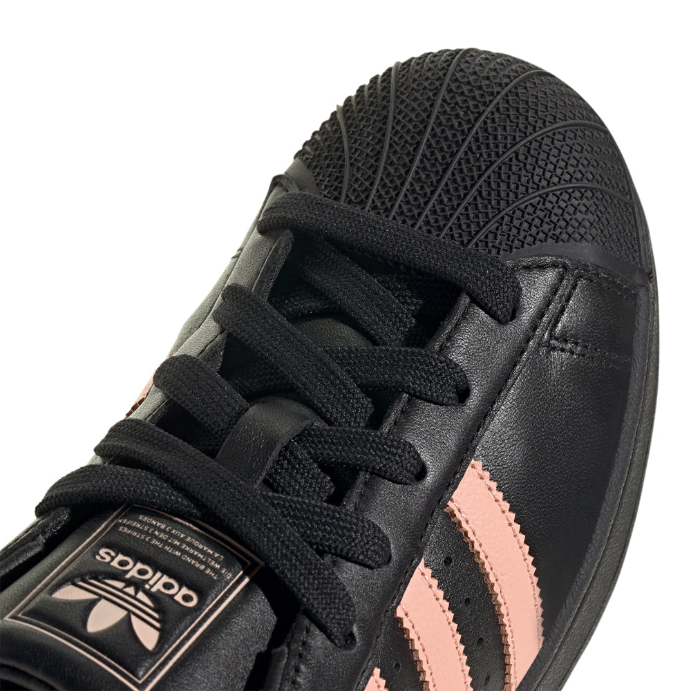 Adidas Superstar womens sneakers in action, displaying grip and comfort during a casual outing.