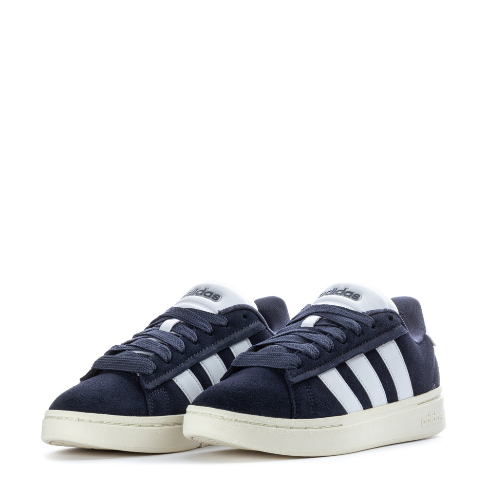 Adidas Grand Court Alpha sneakers on a model during a casual outing, demonstrating versatility.