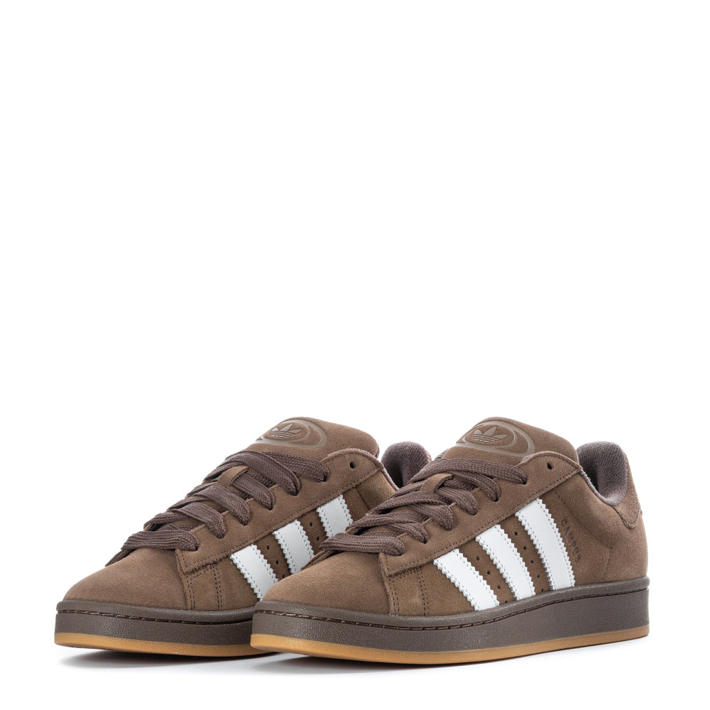 Lifestyle shot of adidas Campus mens sneakers worn in a casual urban setting.