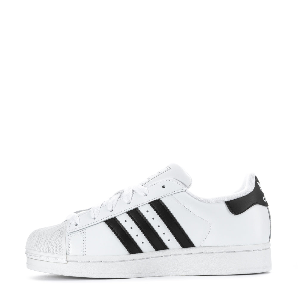 Side view of adidas youth shoes highlighting the signature 3-Stripes and cushioning