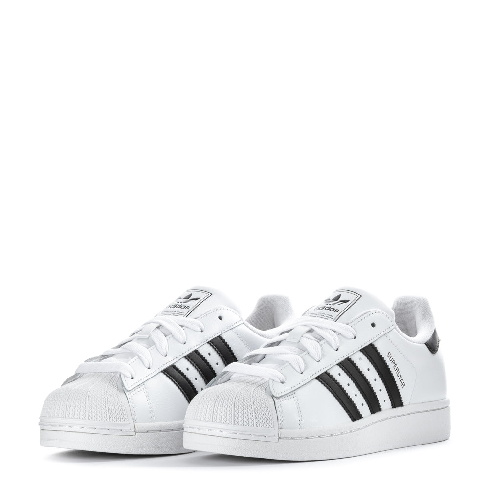Young adult wearing adidas Superstar II sneakers for casual outings