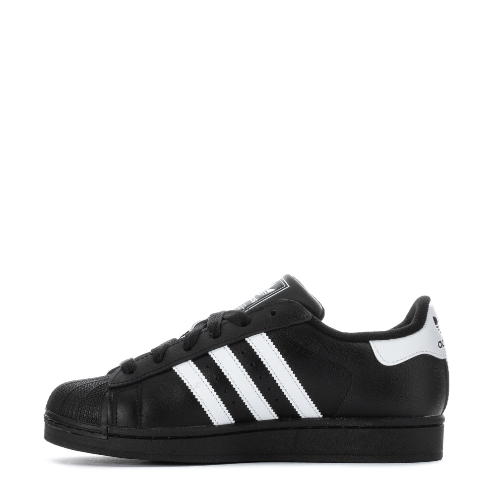 Adidas Superstar II Youth Sneakers worn by a stylish youth, perfect for casual outings.