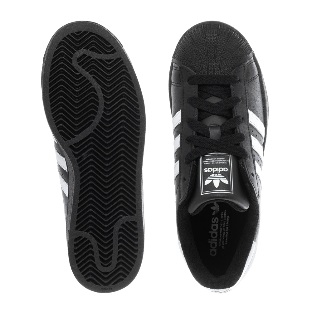 Close-up of Adidas Superstar II Youth Sneakers highlighting the iconic rubber shell-toe.