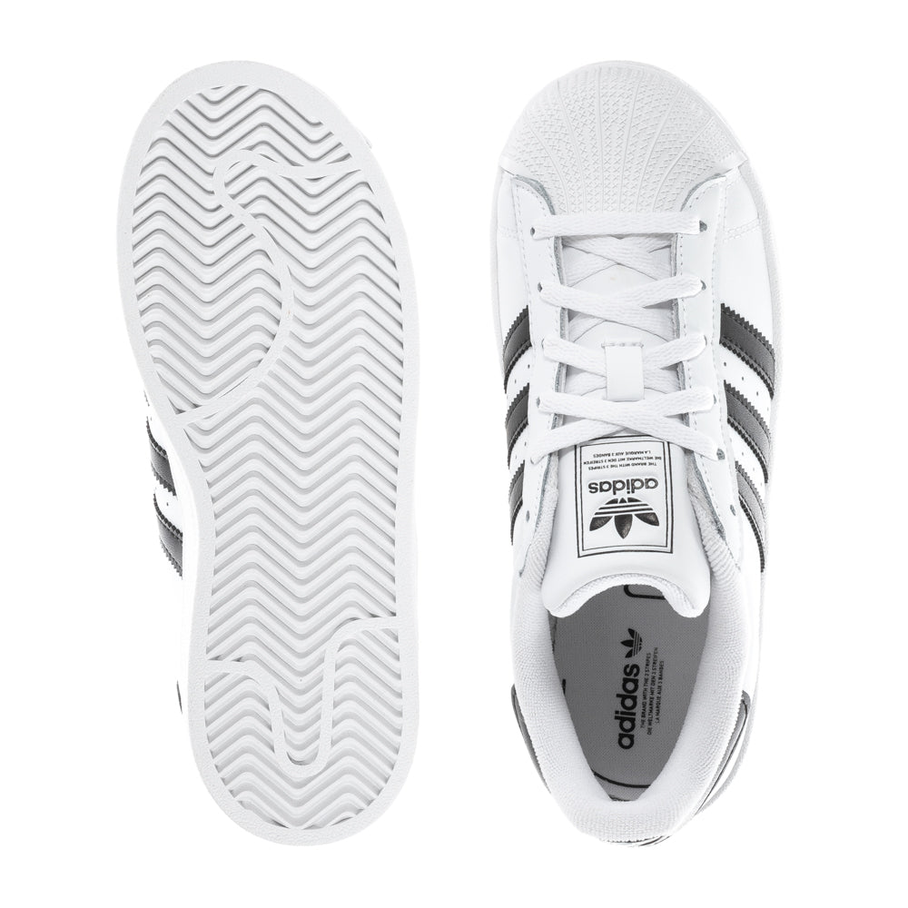 Side view of Adidas Superstar II Kids Sneakers showcasing the classic lace-up style and three-stripe design.