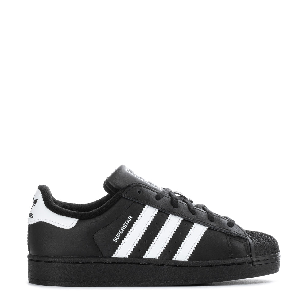 Close-up of adidas Superstar II kids sneakers showing the leather upper and three-stripe design