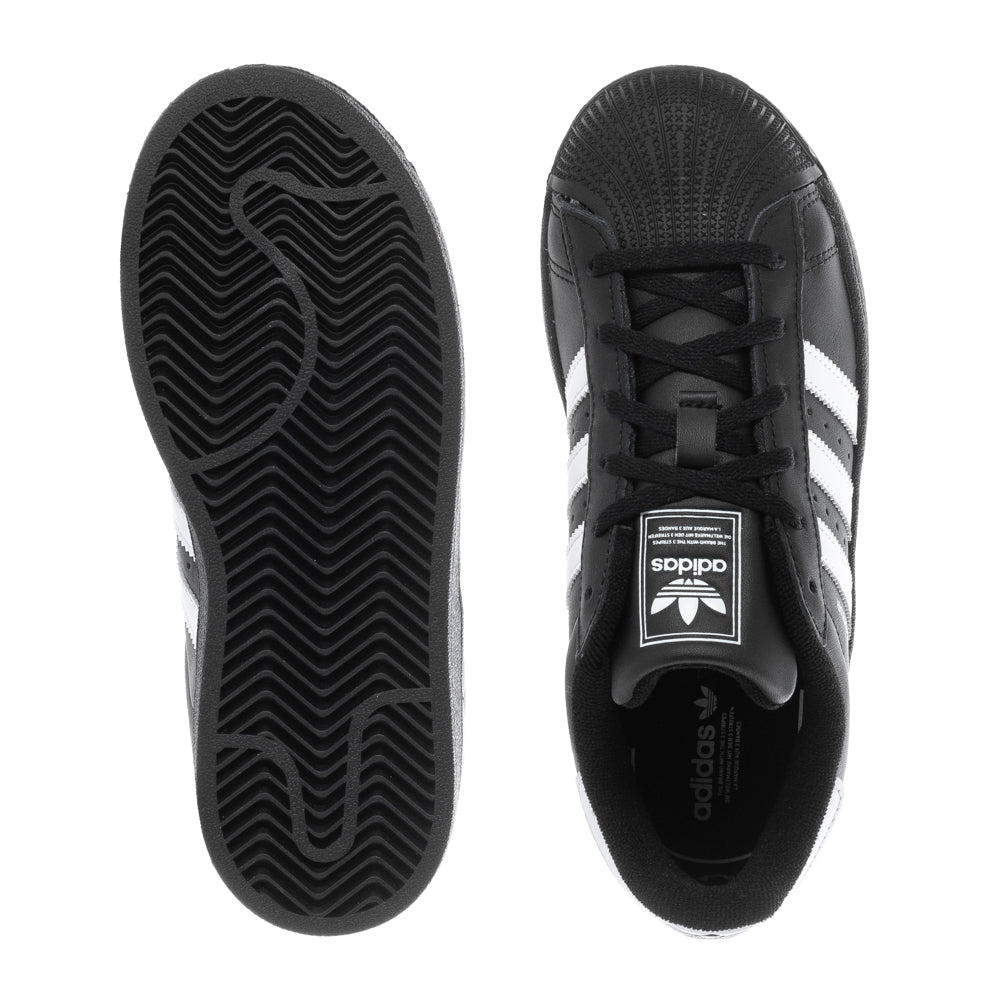 Close-up of adidas Superstar II kids sneakers showing the leather upper and three-stripe design