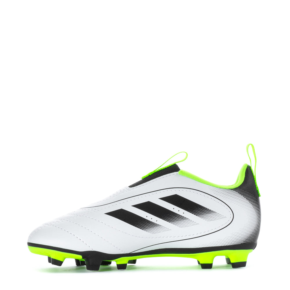 Young player wearing versatile kids soccer shoes for outdoor sports