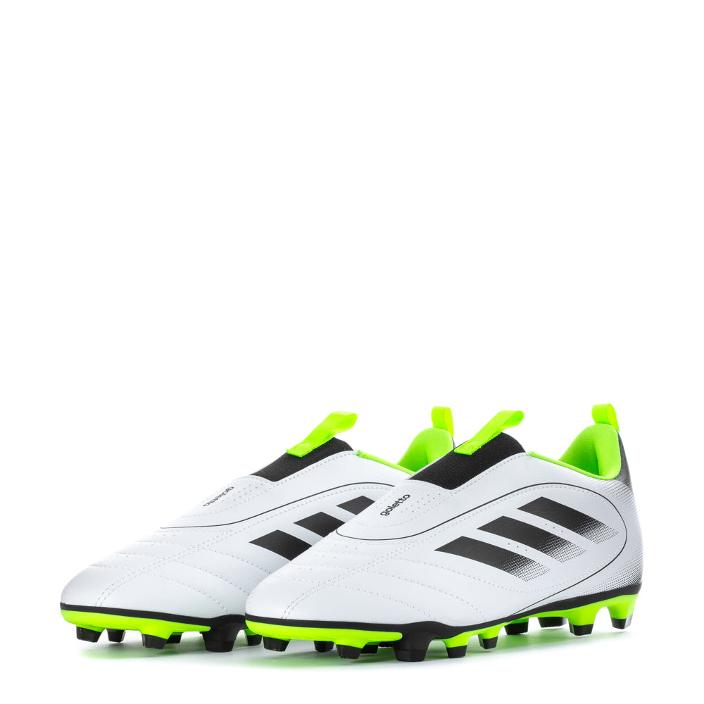 Close-up of versatile FG/MG studs gripping firm ground during a youth soccer match