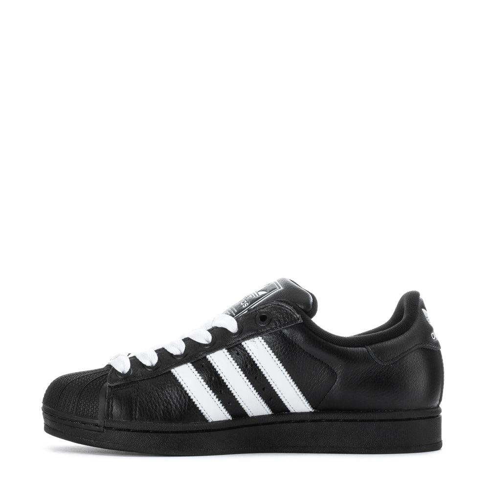 Close-up of the rubber shell-toe and serrated 3-Stripes on adidas Superstar II sneakers
