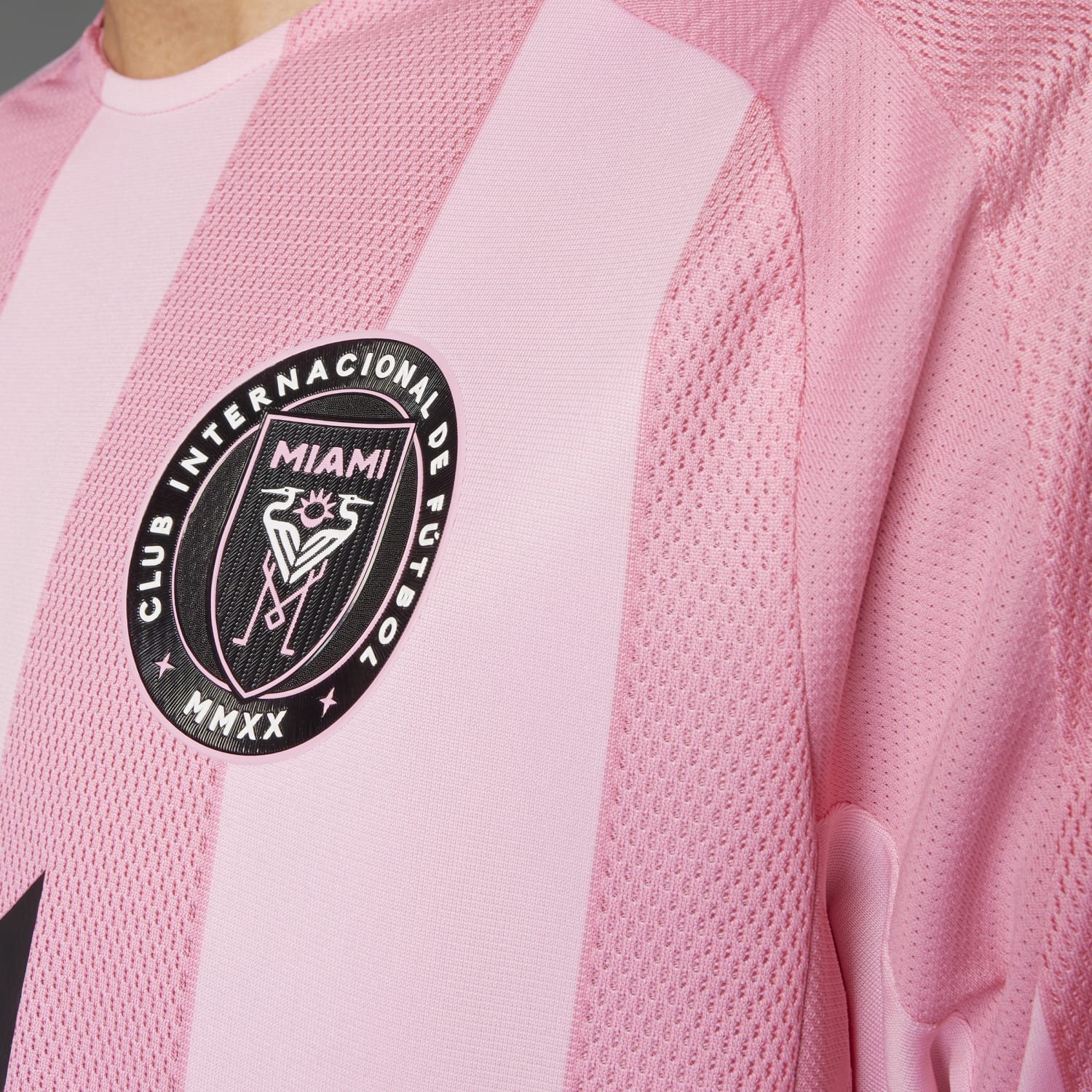 Side view of the Messi jersey highlighting the three-stripe adidas logo and comfortable fit.