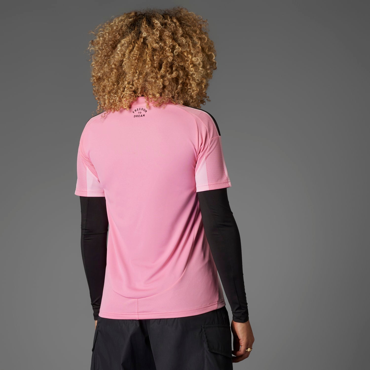Front view of the Adidas Inter Miami Womens Home Soccer Jersey highlighting the team seal and sponsor logo.