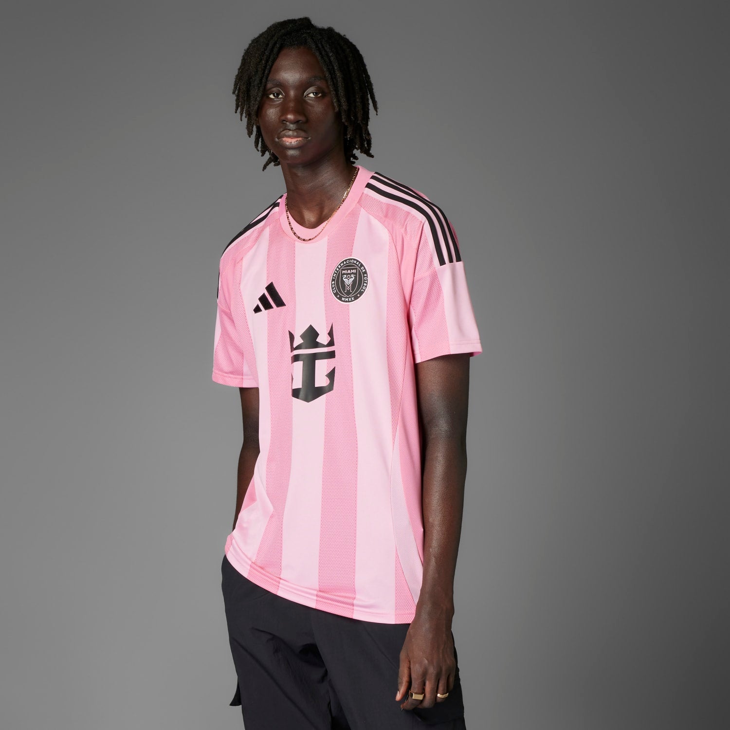Close-up of the adidas signature three stripes on the sleeve of the soccer jersey