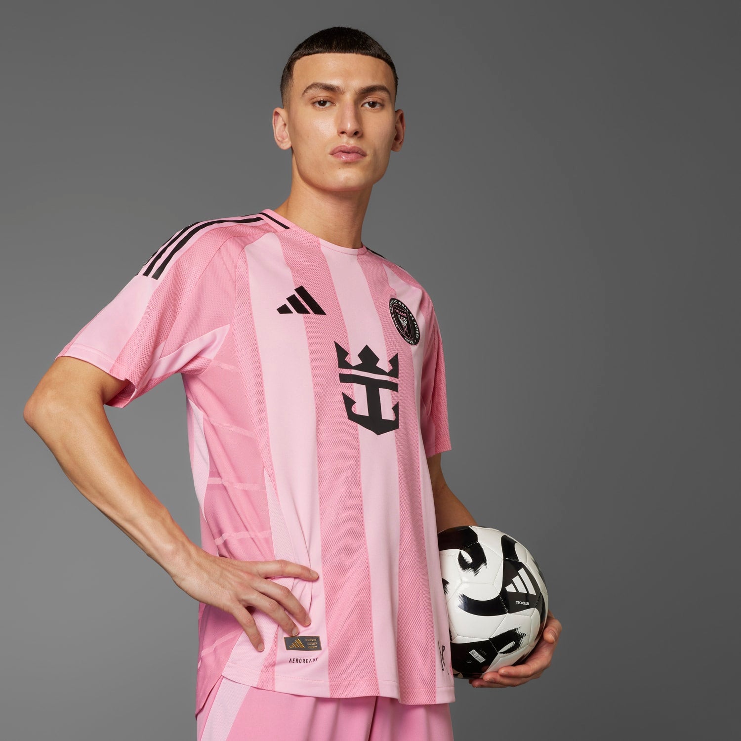 Side angle of the Inter Miami jersey highlighting the adidas three-stripe logo and AEROREADY technology.