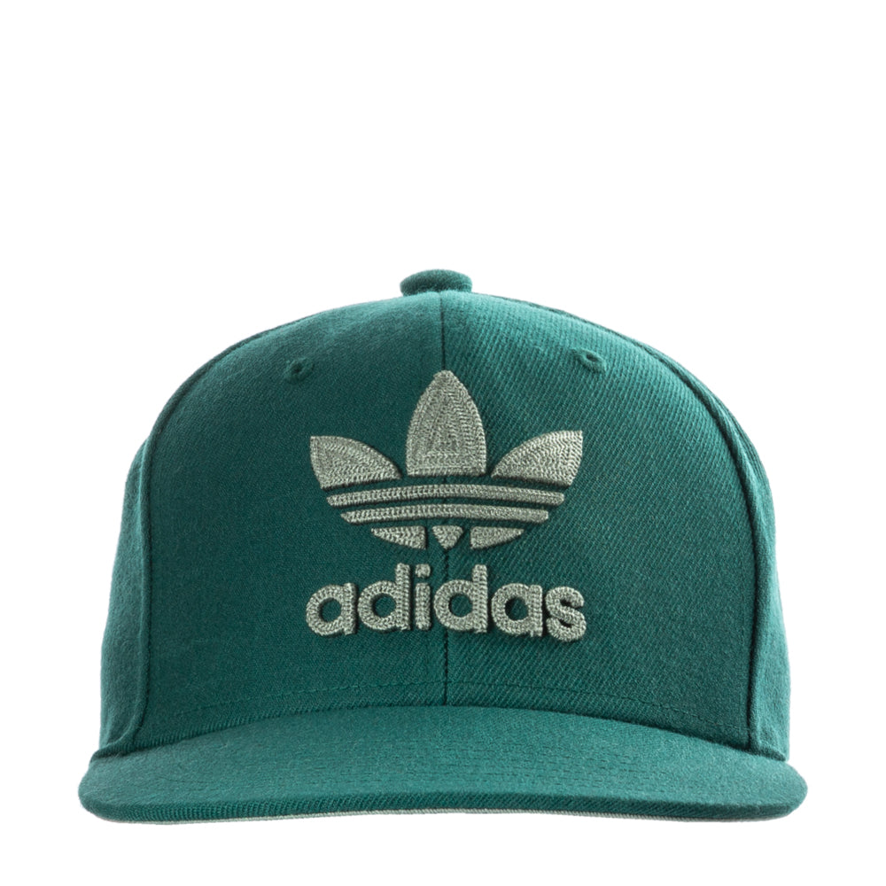 Front view of Adidas Originals Trefoil Chain Snapback Cap showcasing the iconic logo and chain detail in bright sunlight.