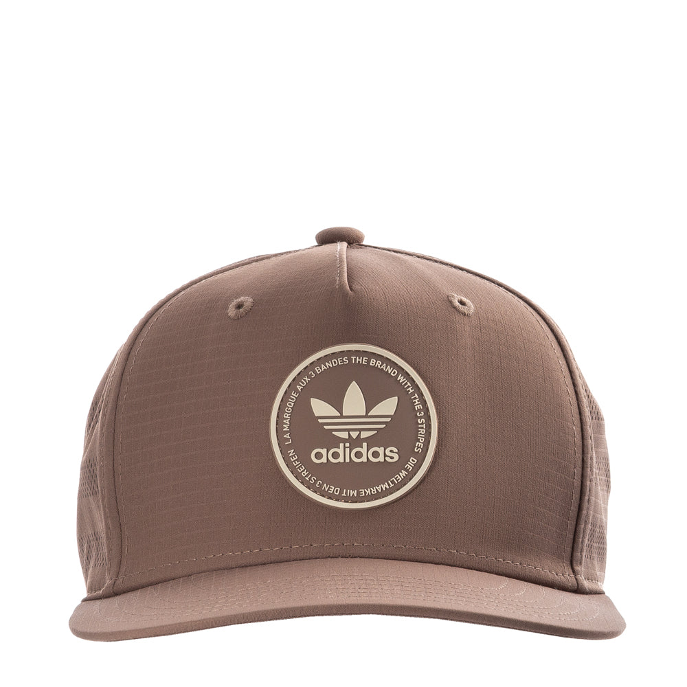 Front 3/4 view of the white adidas OG Emblem Snapback cap showing the classic OG patch and curved brim