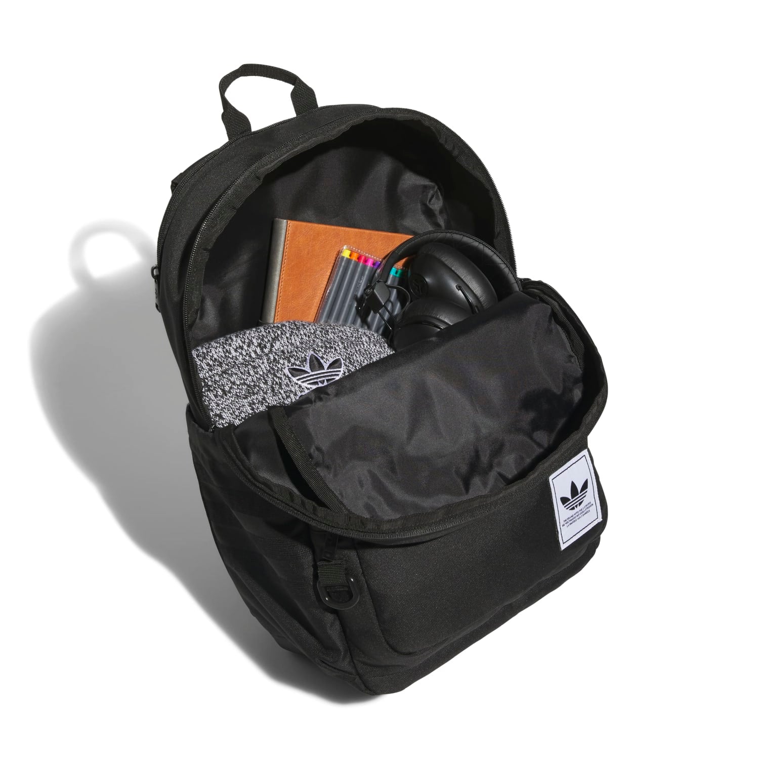 Side angle of the backpack featuring built-in water bottle holder and ergonomic straps