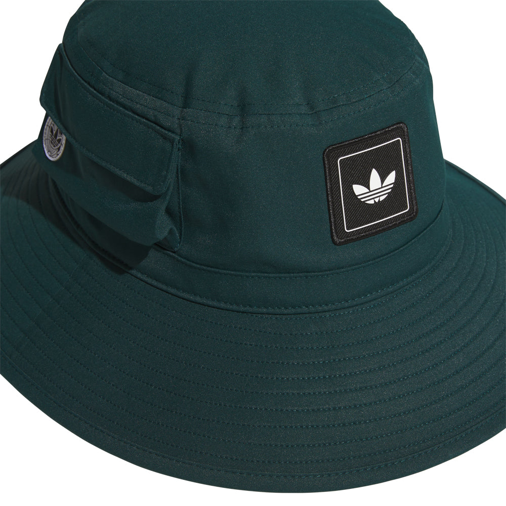 Ultimate Utility Boonie Hat in action during a fishing trip, showcasing its wide brim and stylish design.