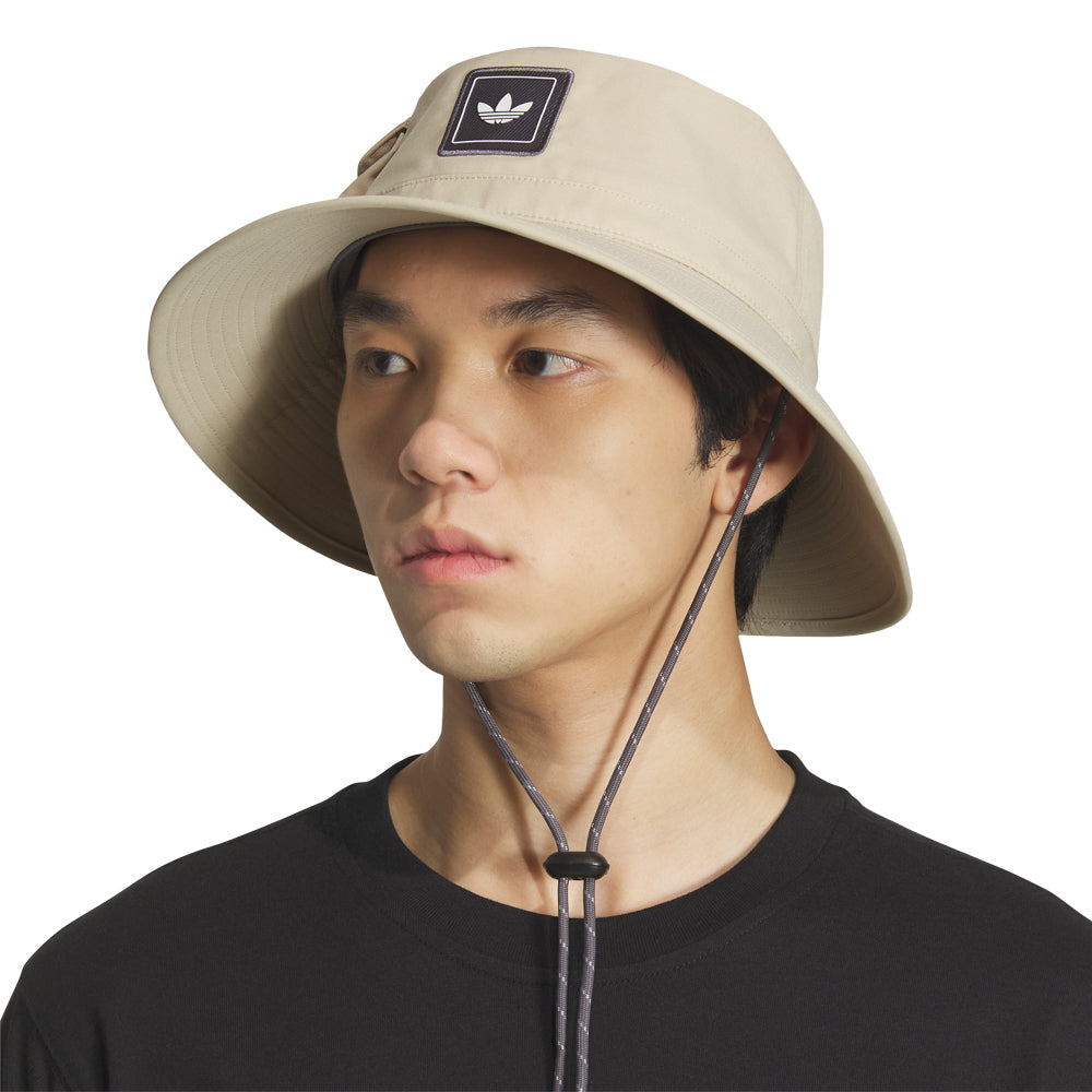 Person wearing Adventure Ready Utility Boonie Hat while fishing on a sunny day.