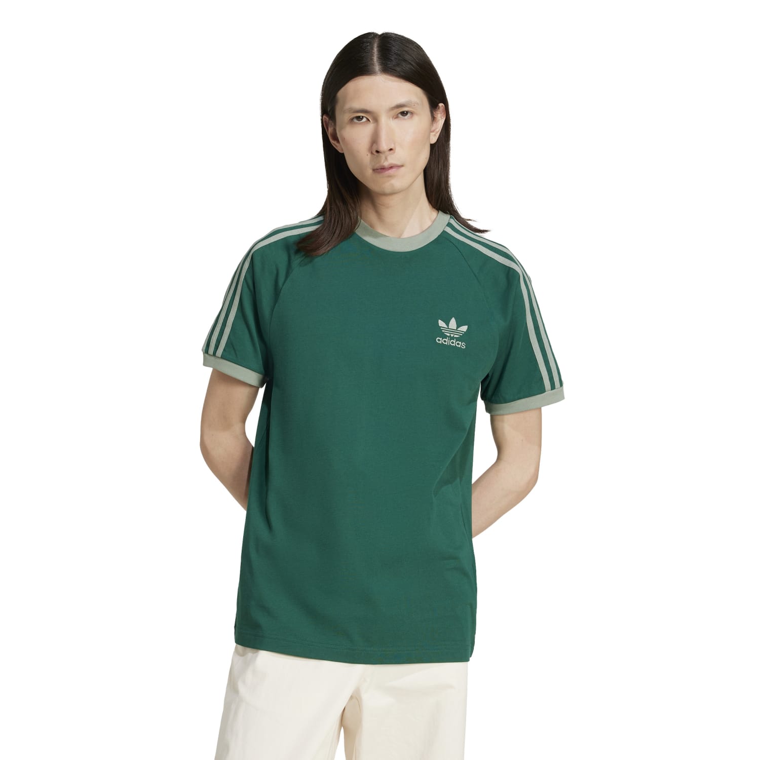Model wearing adidas mens casual tee with slim fit and retro design