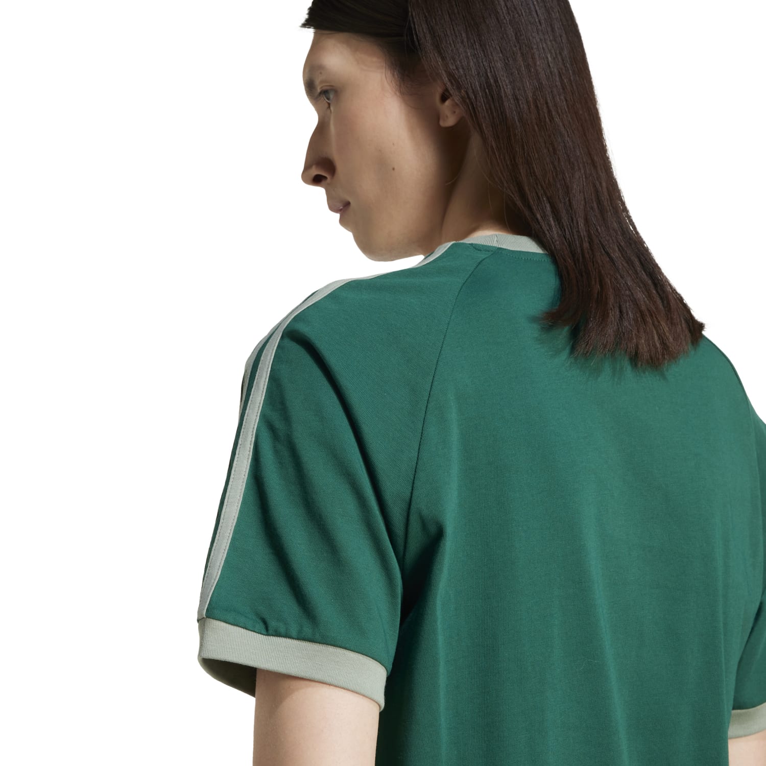 Model wearing adidas mens casual tee with slim fit and retro design