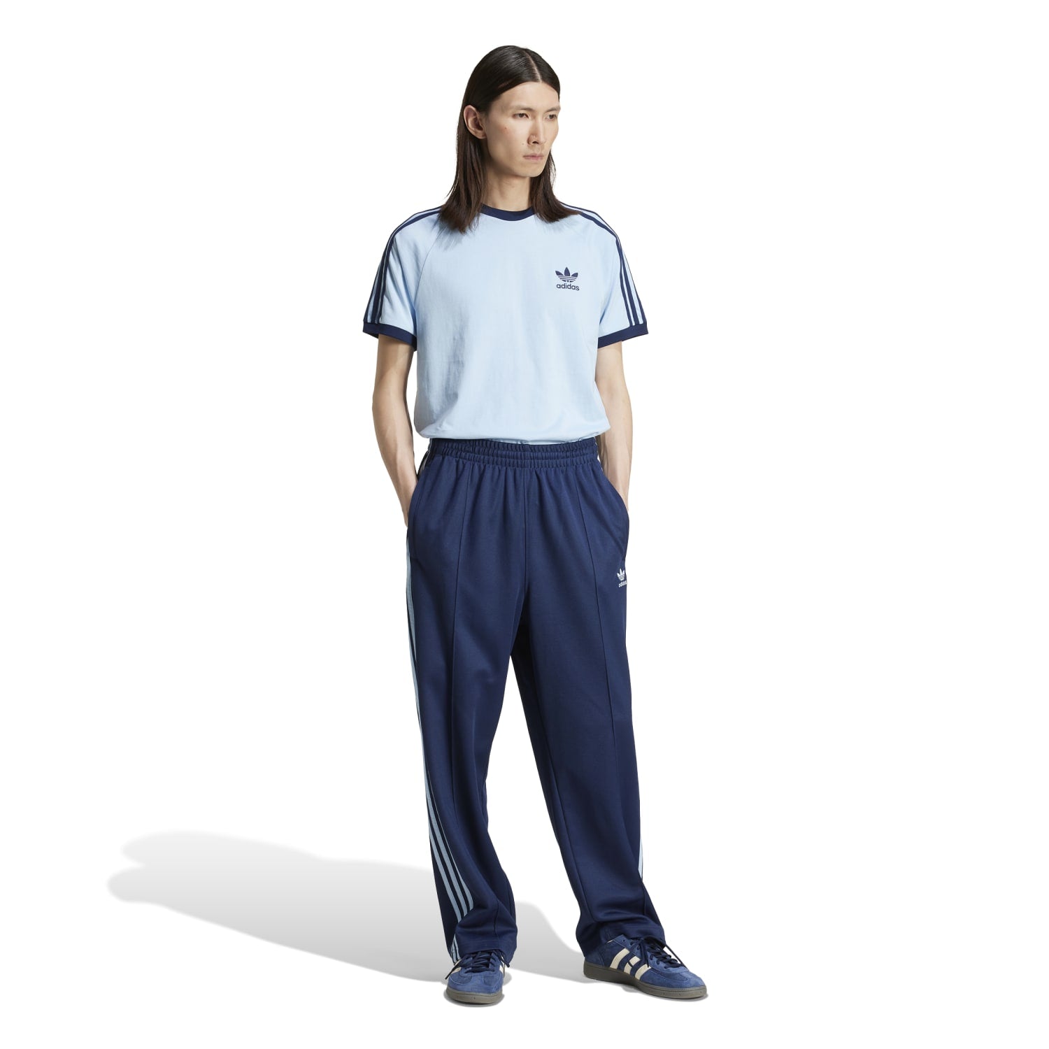 Close-up of soft single-jersey fabric texture and 3-stripe sleeve detail for comfortable fit