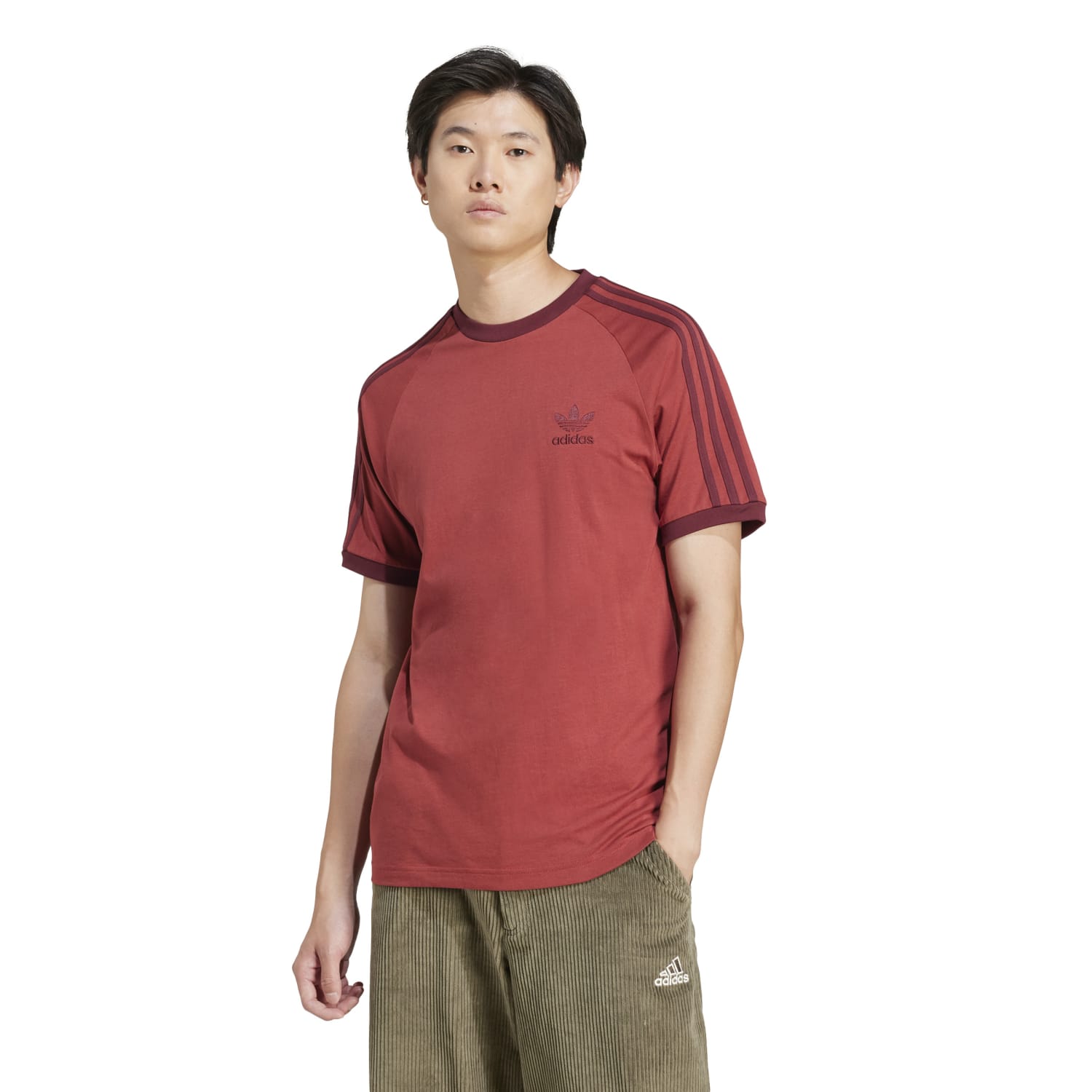 Model wearing vintage adidas tee with contrast hem and ribbed crewneck
