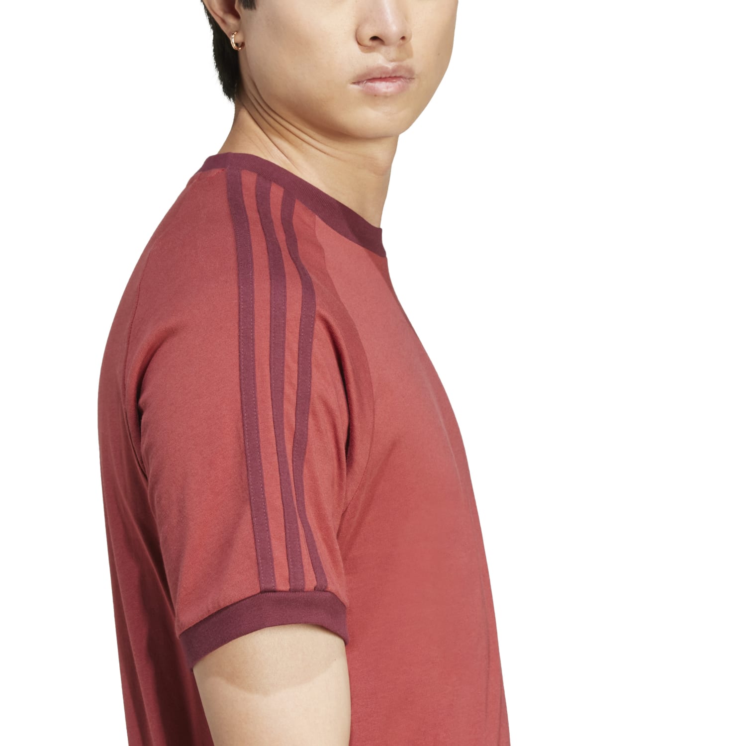Model wearing vintage adidas tee with contrast hem and ribbed crewneck