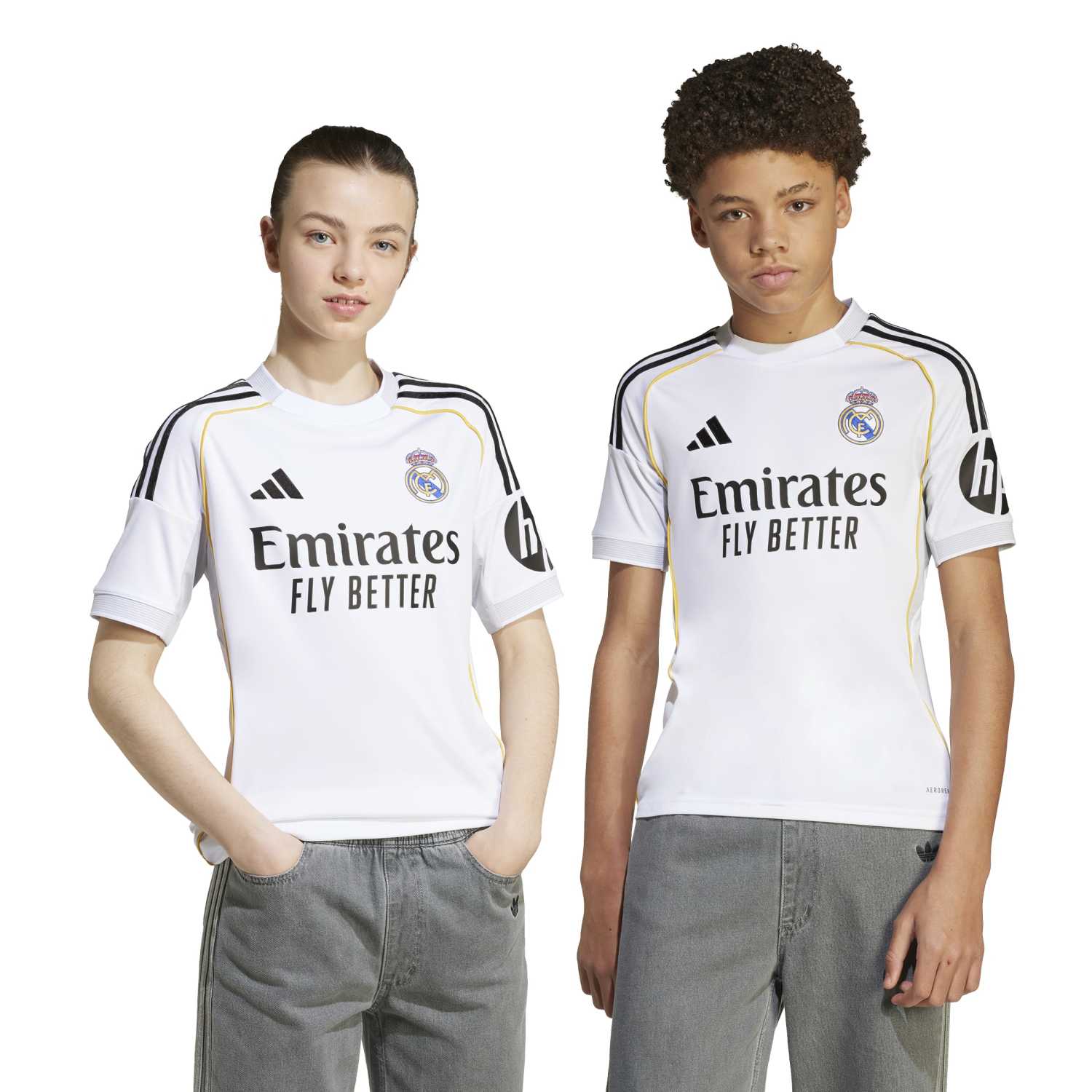 Child wearing Real Madrid youth soccer jersey during match day, showcasing comfort and style