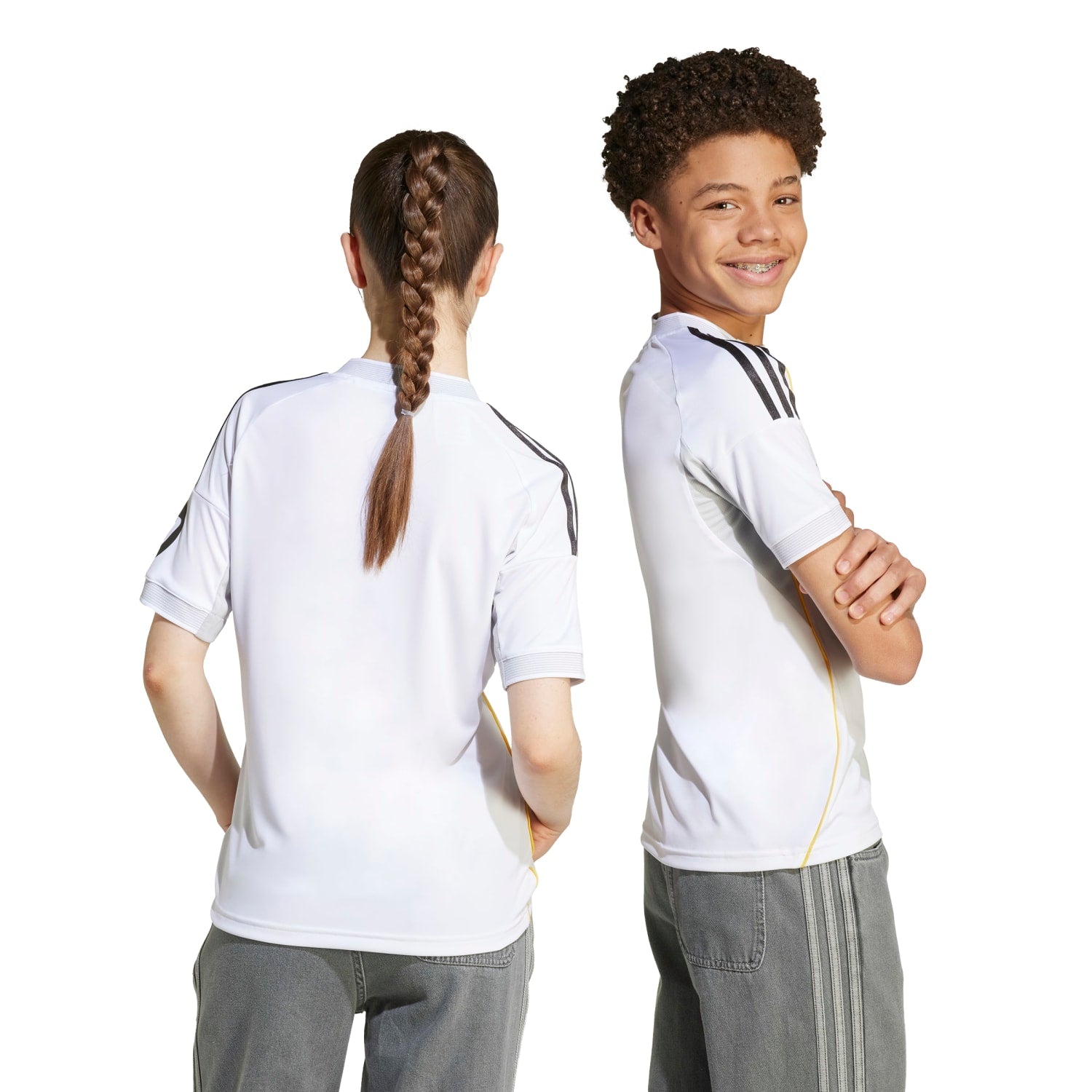 Child wearing Real Madrid youth soccer jersey during match day, showcasing comfort and style