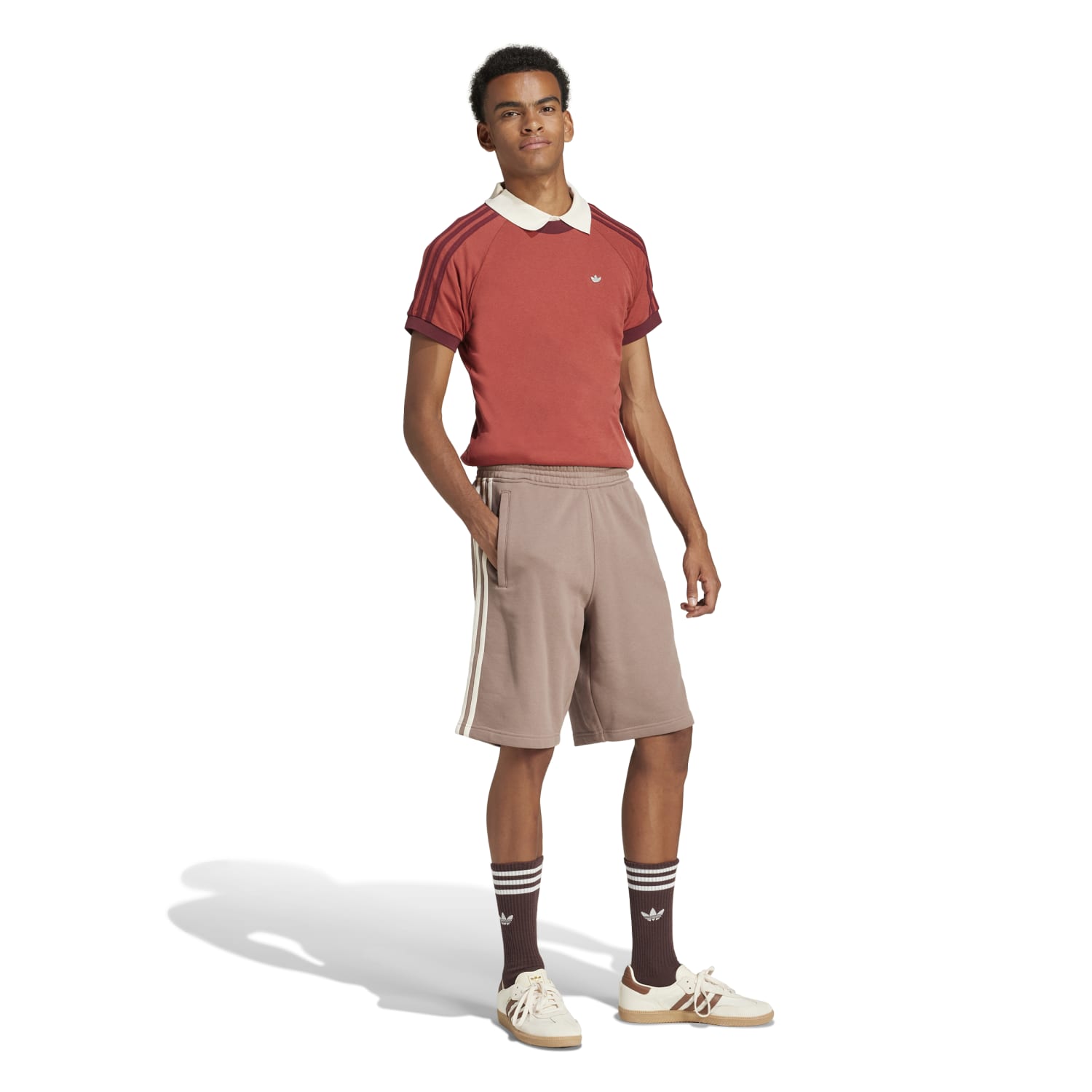 Close-up of the Adidas three-stripe design on mens athletic shorts.