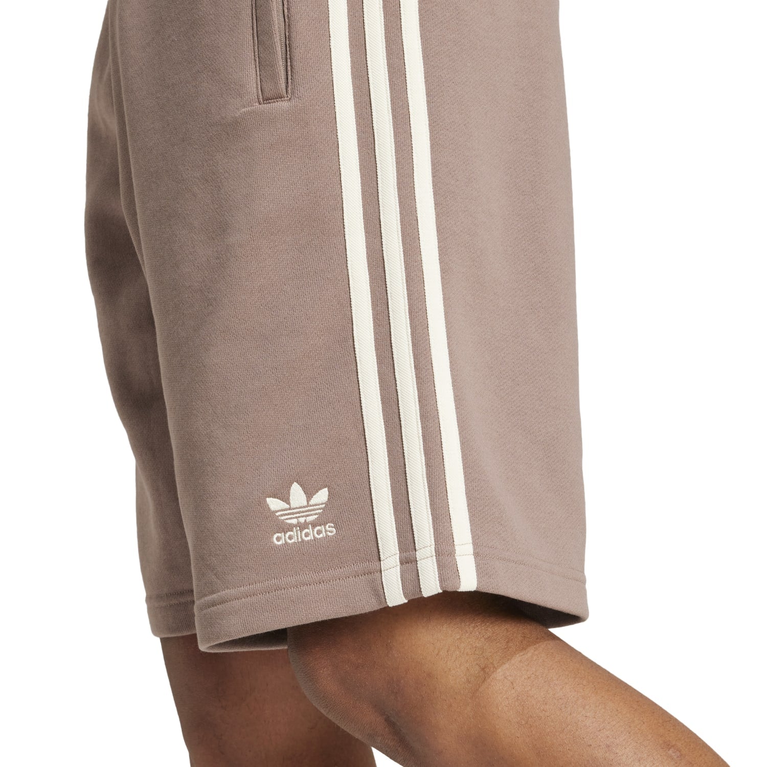 Side view of Adidas 3-Stripes shorts in action during a workout.