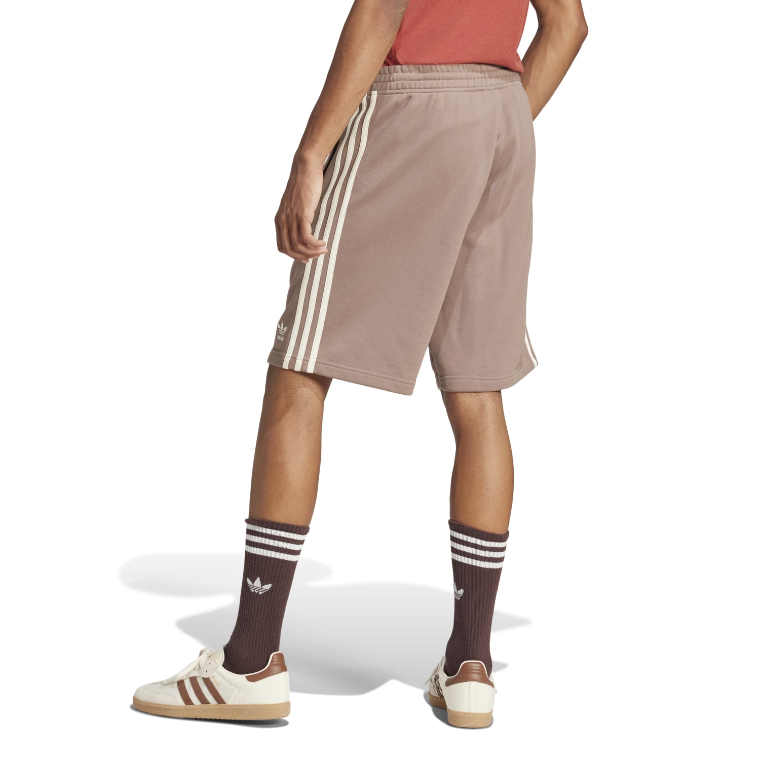 Close-up of the Adidas three-stripe design on mens athletic shorts.
