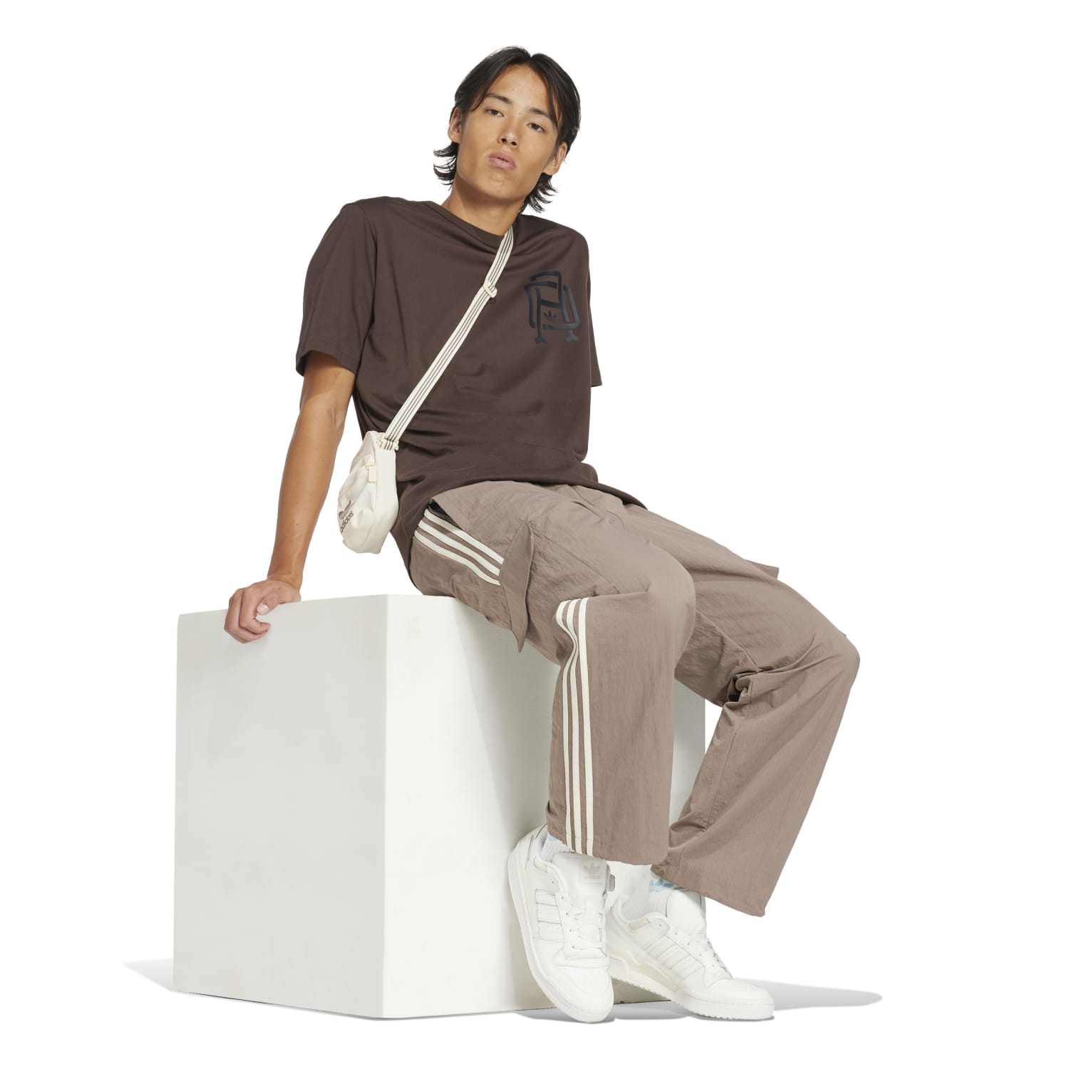 Back view with bungee-adjustable hem cinched over hiking boots