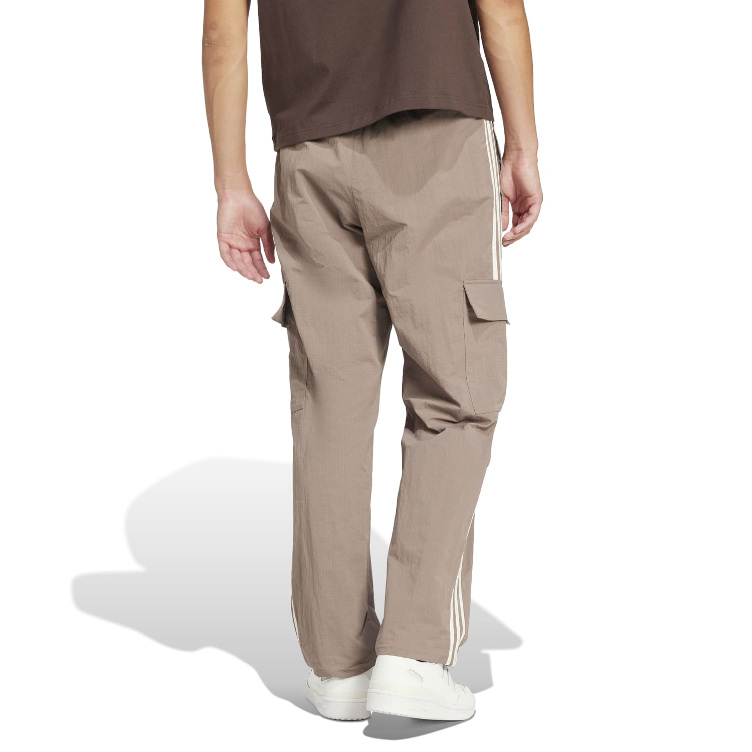 Back view with bungee-adjustable hem cinched over hiking boots