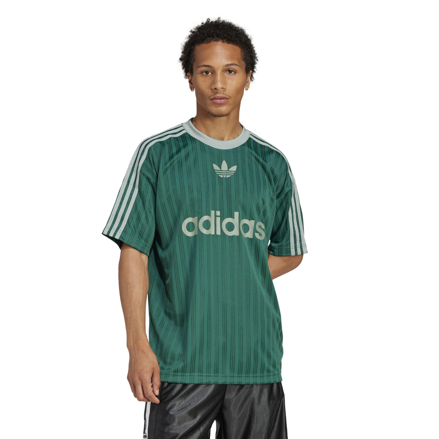 Side angle of the jersey styled with denim, highlighting how it works as stylish casual wear for men