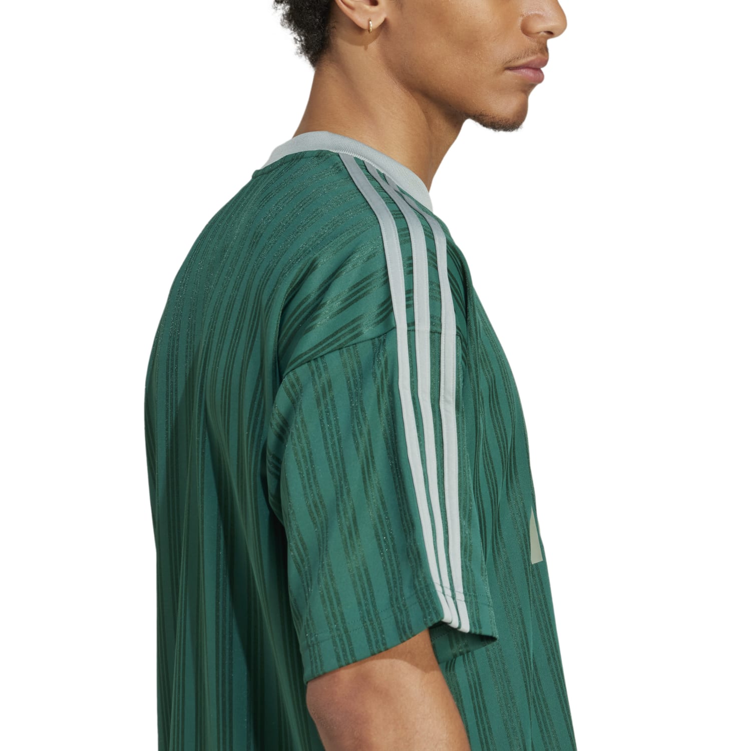 Side angle of the jersey styled with denim, highlighting how it works as stylish casual wear for men