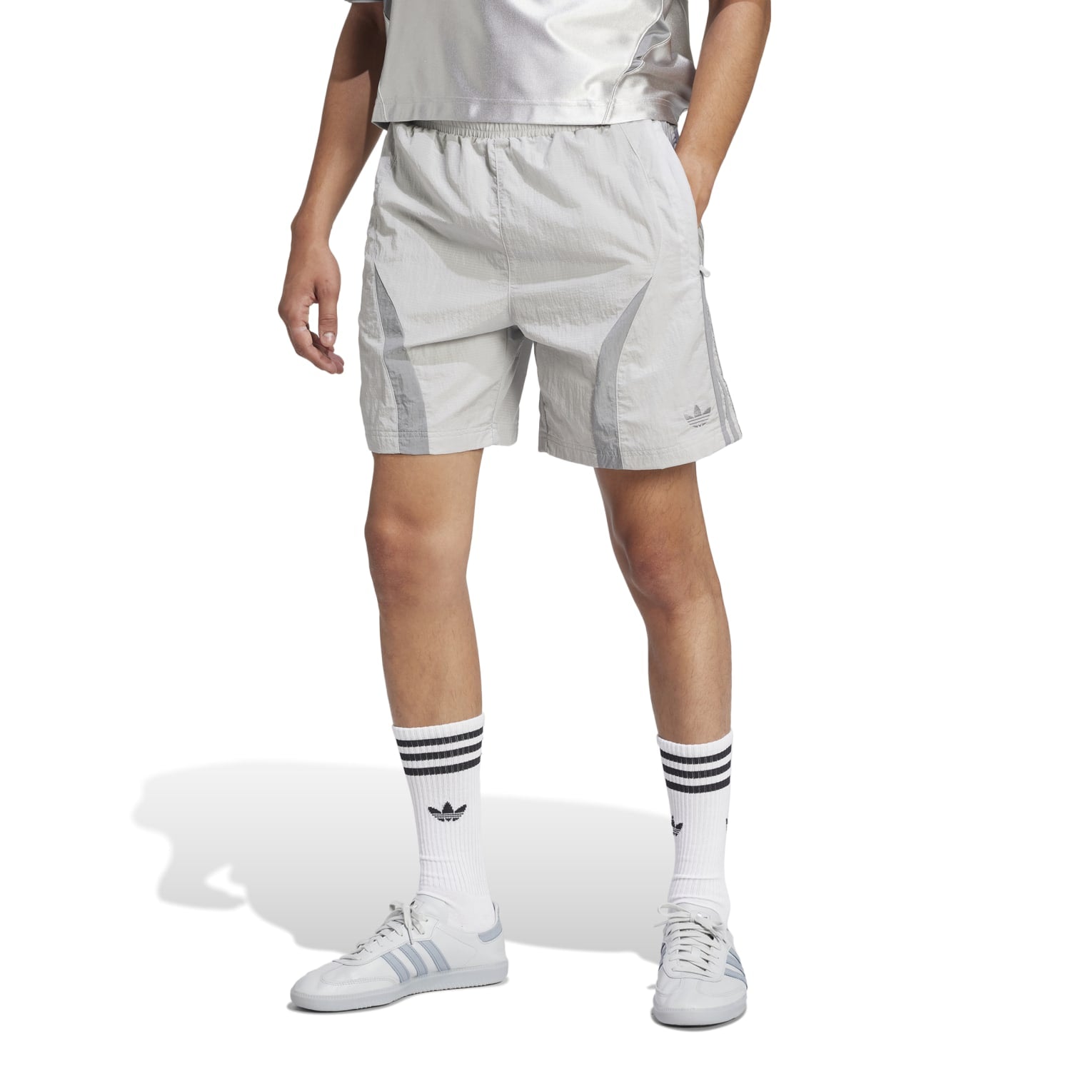 Side view showcasing the relaxed fit of Adicolor mens shorts.