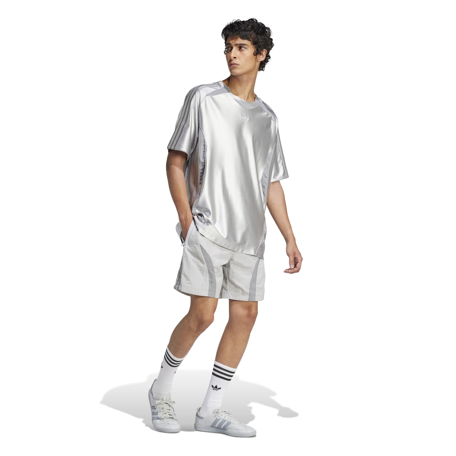 Model wearing Retro Adicolor 2000s Mens Casual Shorts at the beach.
