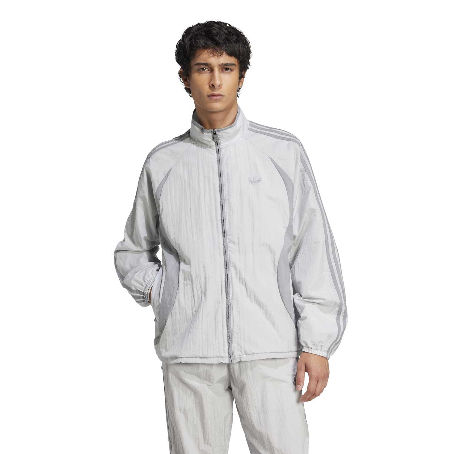 Side view of the Adicolor Vintage Woven Track Jacket, highlighting its sleek design and fabric texture.