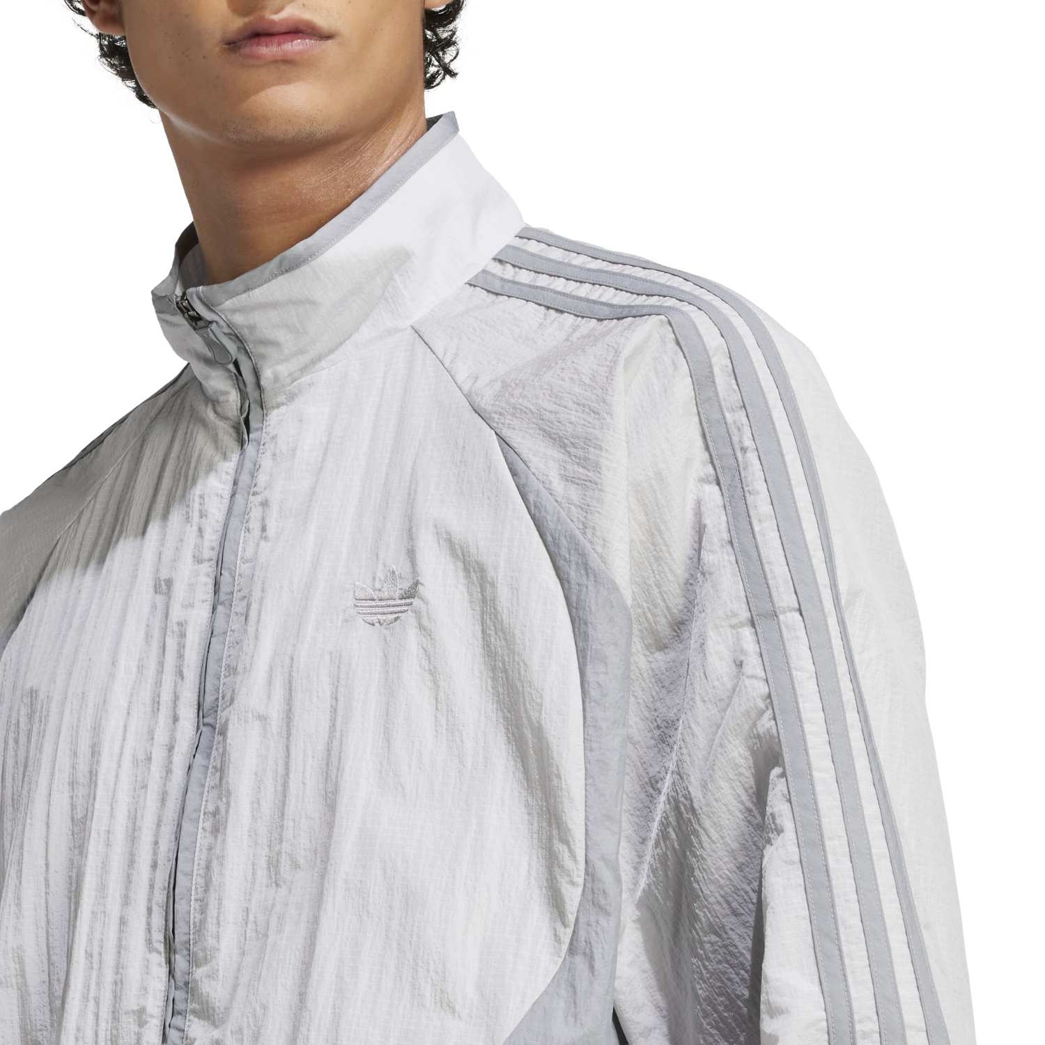 Adicolor Vintage Woven Track Jacket on display from the front, showcasing its vibrant colors and fit.