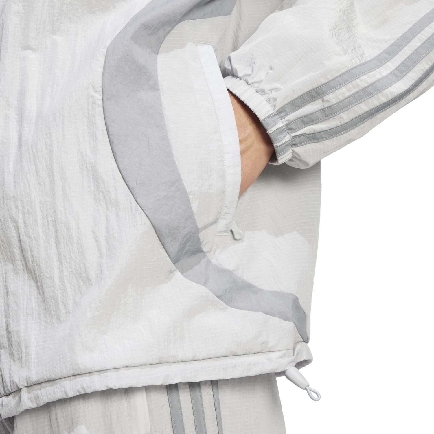 Side view of the Adicolor Vintage Woven Track Jacket, highlighting its sleek design and fabric texture.