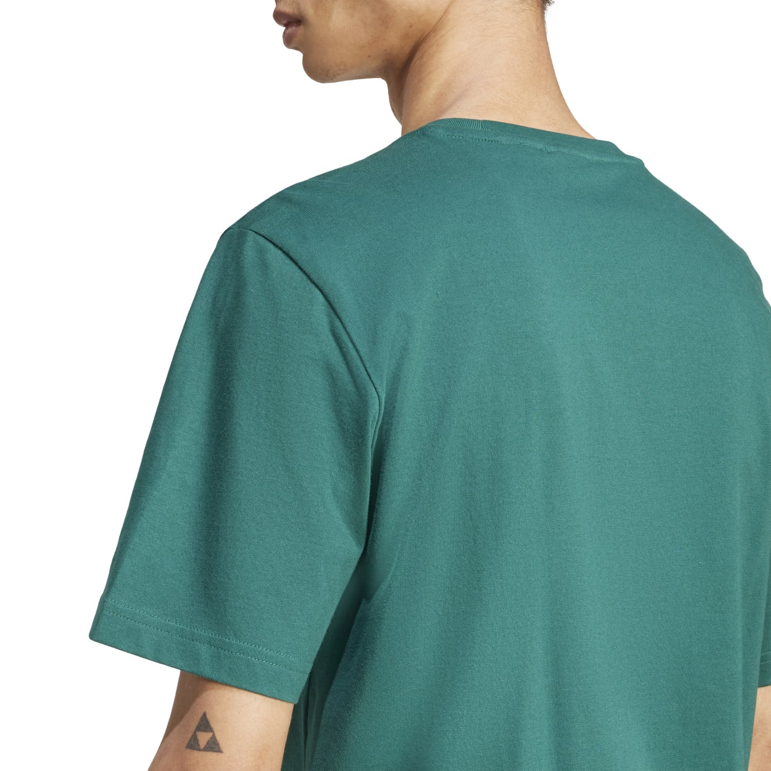 Side angle showcasing the loose fit of the Adidas Monogram Mens Tee, ideal for comfort.