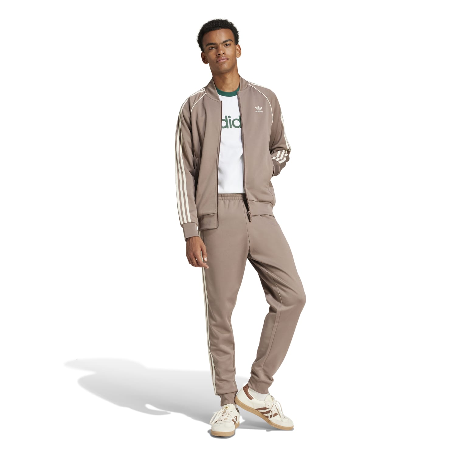 Side view of the Adidas Superstar Slim Fit Track Pants highlighting the tapered cuffs and iconic 3-Stripes.
