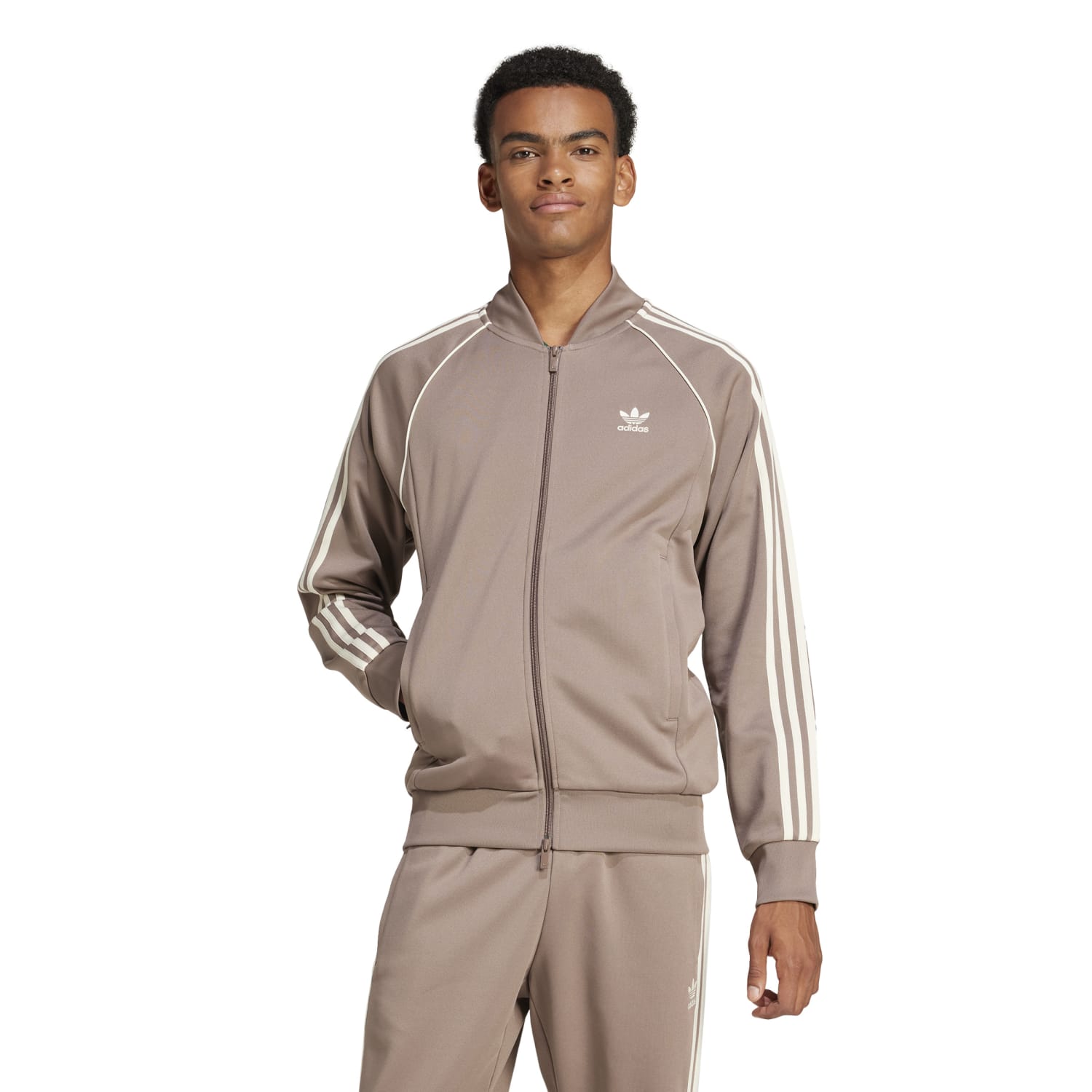 Side angle of the mens adidas track jacket with zip pockets styled with casual streetwear