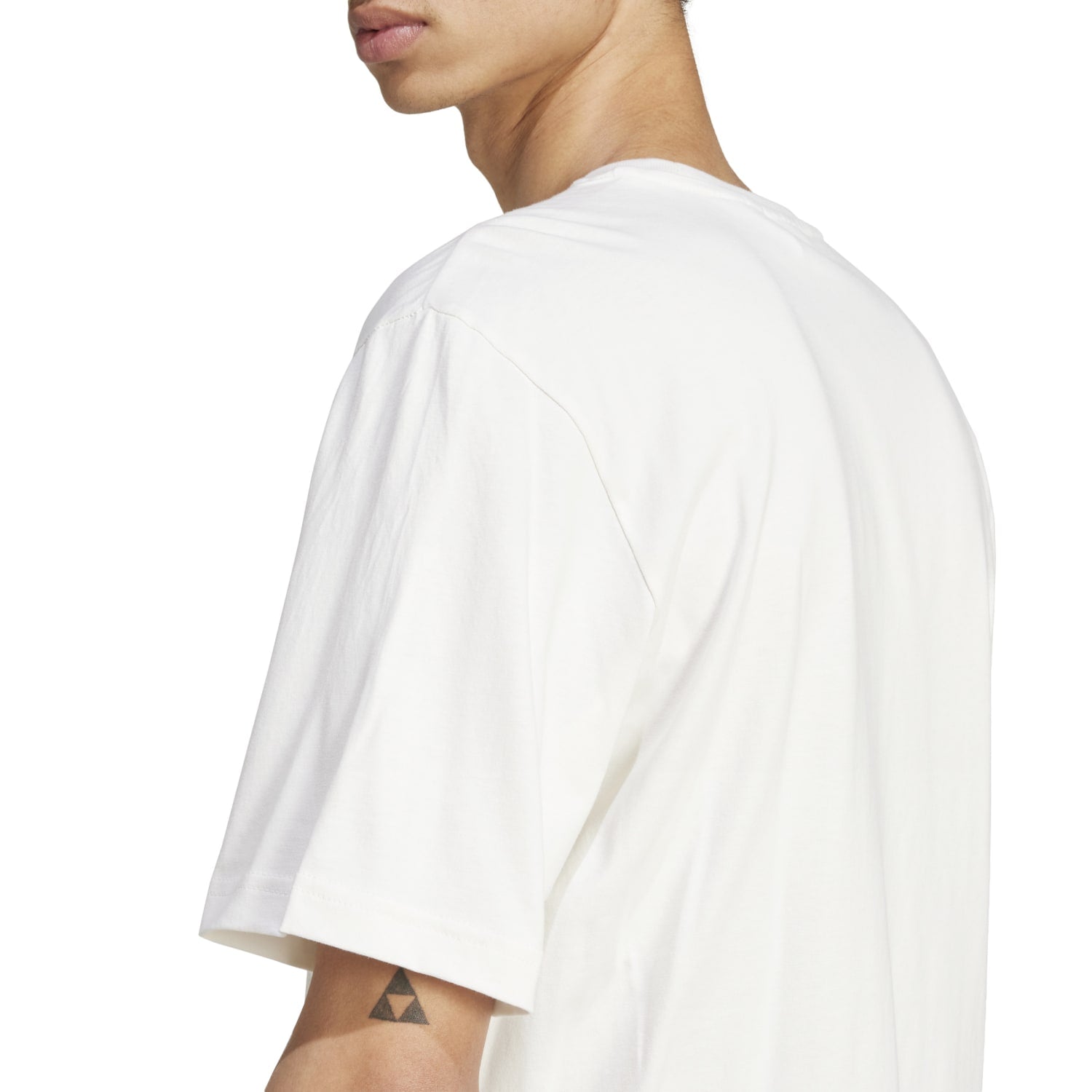 Side view of Adidas Mens Monogram Tee showing its relaxed fit and comfortable cotton material.