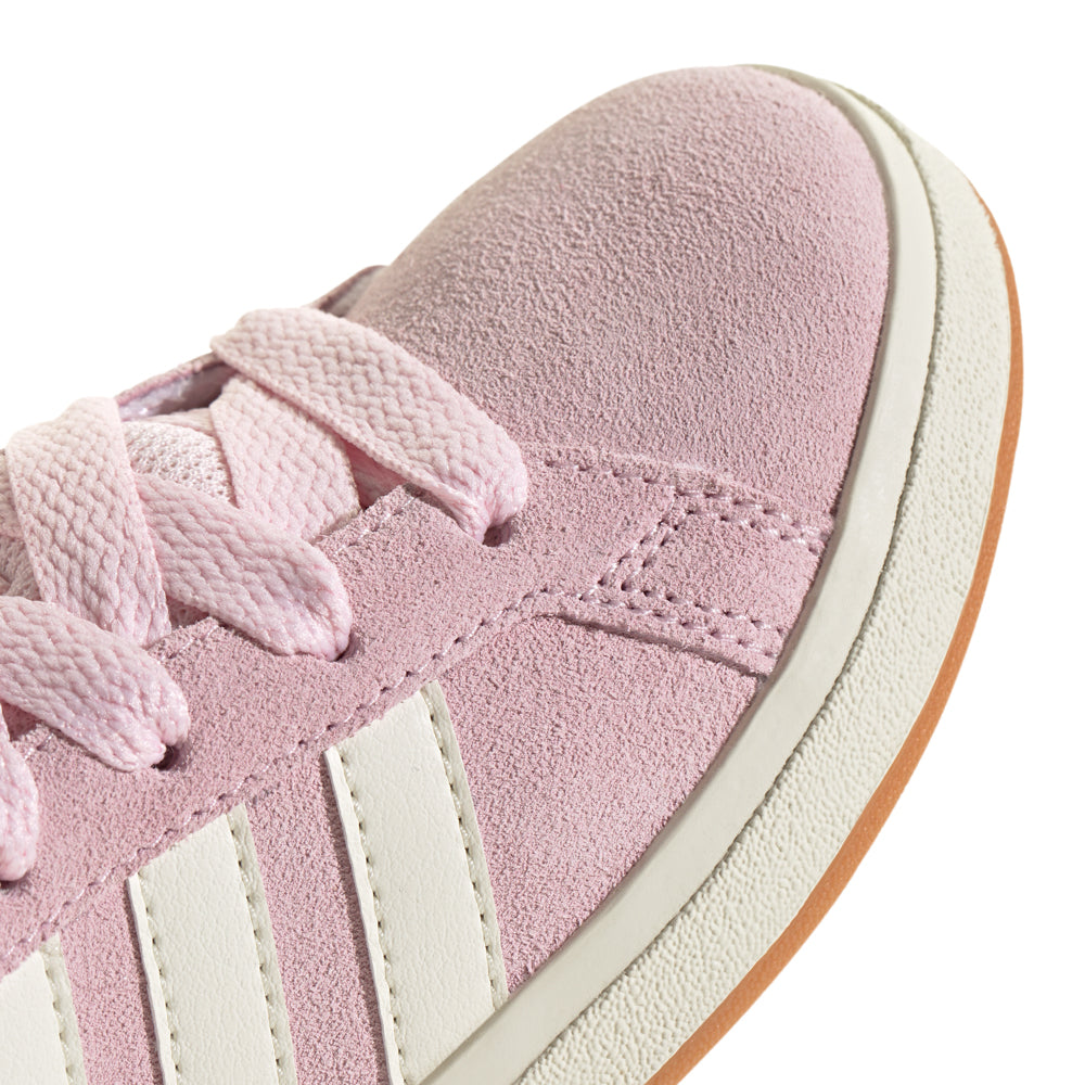 Side view of Adidas kids shoes showing durable sole and classic white leather finish